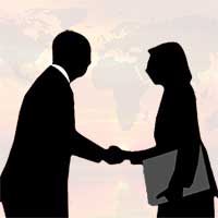 Silhouettes of man and woman shaking hands.