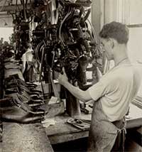 Worker using lasting machine.