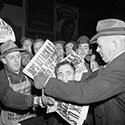 Newsboys selling papers in Times Square following attack on Pearl Harbor.